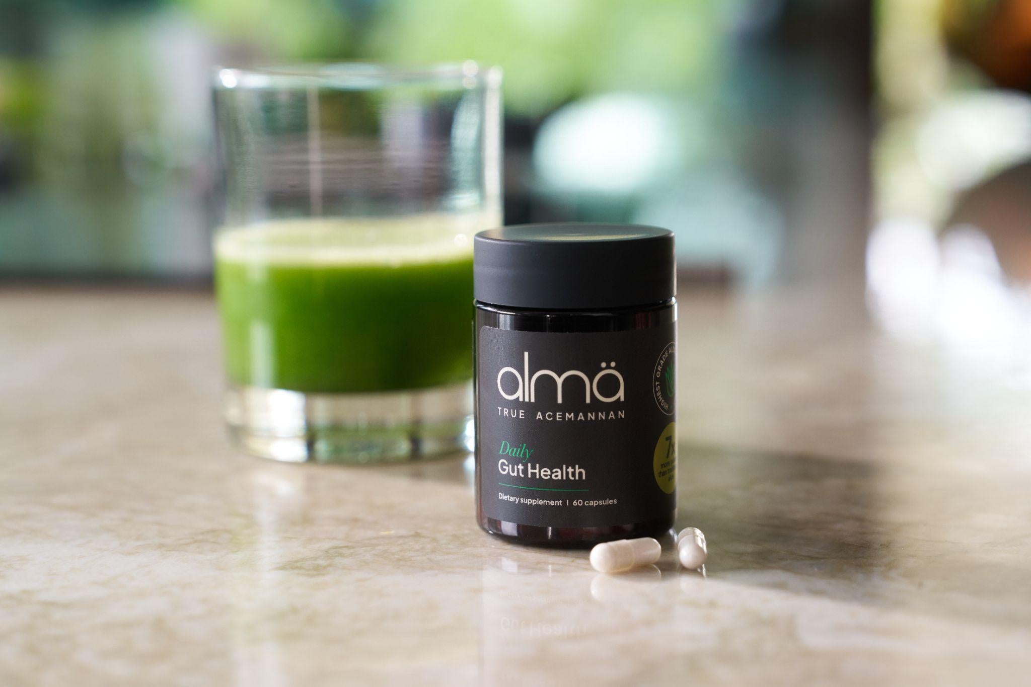 almä Daily Gut Health jar with a green juice